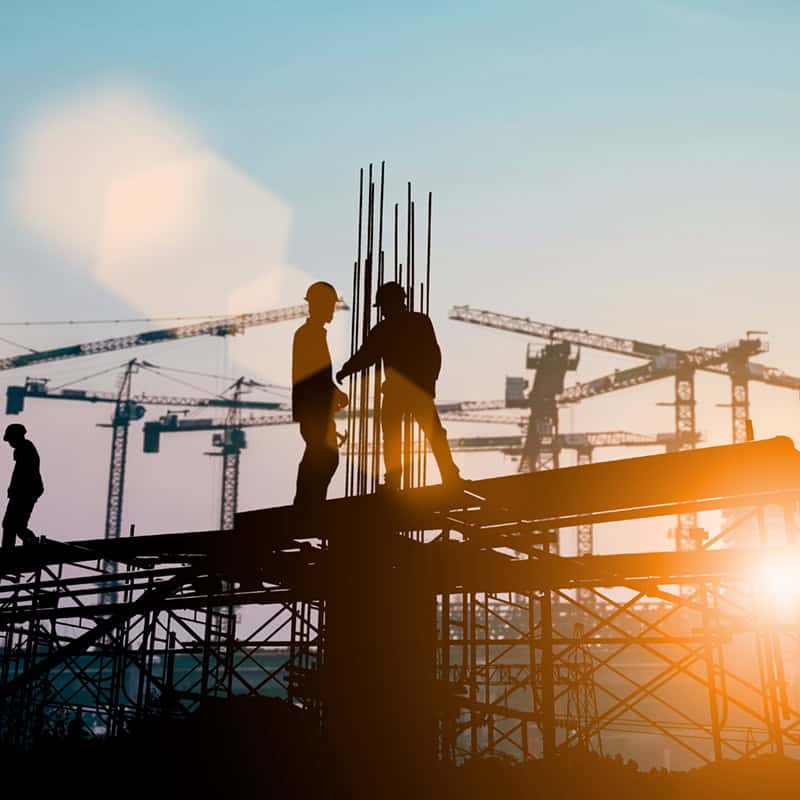 Silhouette of engineer and construction team working at site over blurred background sunset pastel for industry background with Light fair.Create from multiple reference images together.