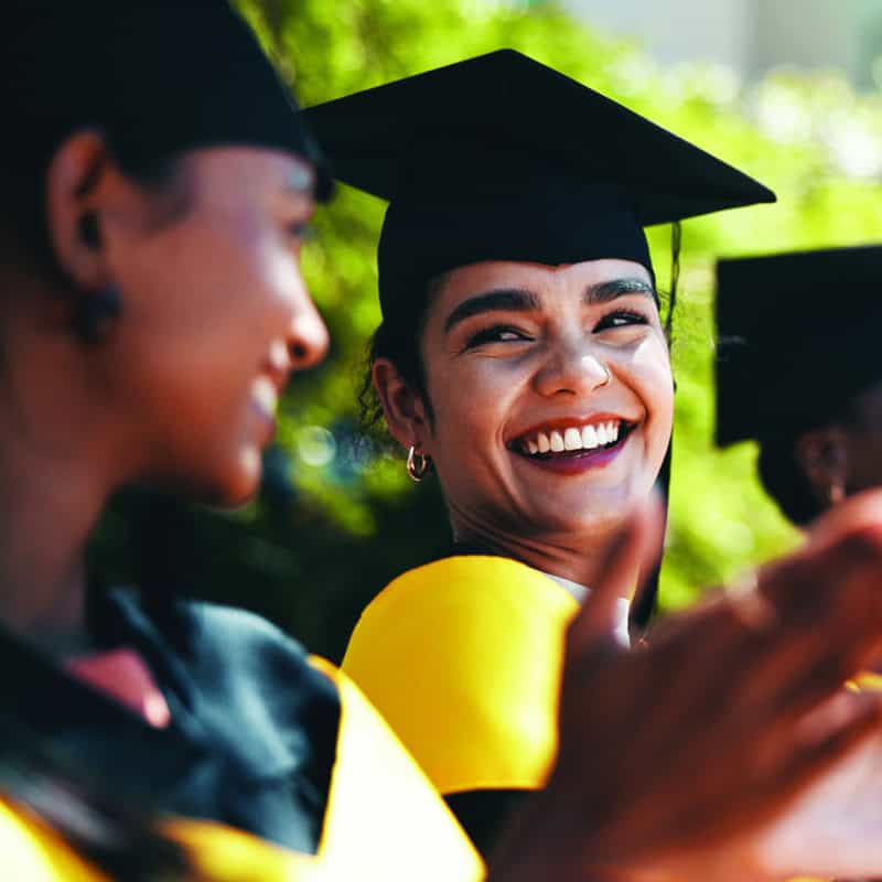 People, students and applause at university for graduation, peer support and happy for achievement. Class, clapping and outdoor on campus for academic success, pride and smile for education milestone